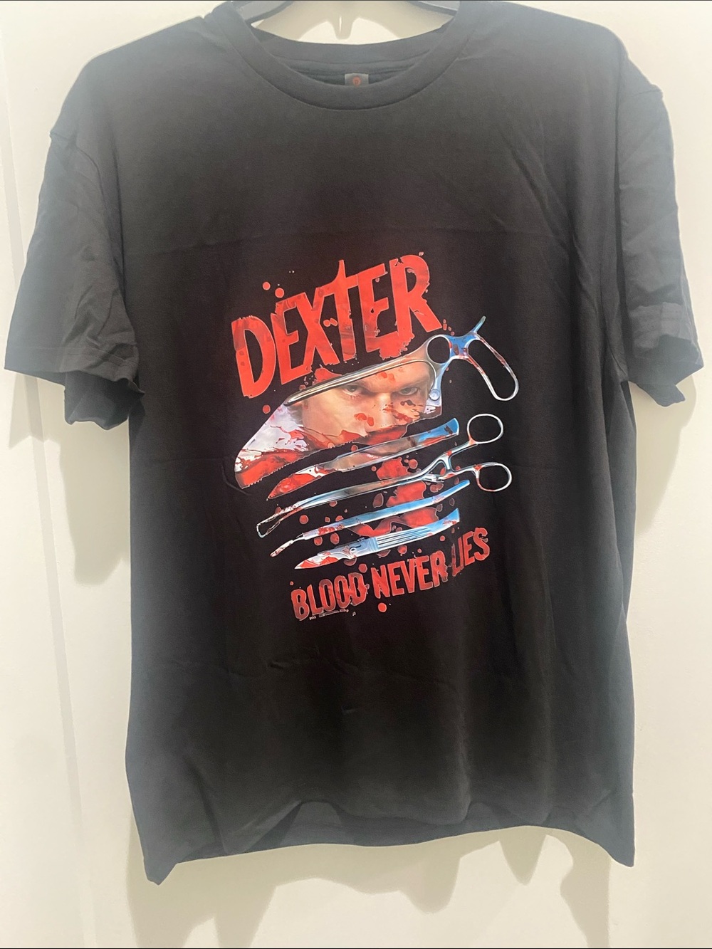 Dexter Black Graphic Tee with Red Logo and Multicolor Surgical Design